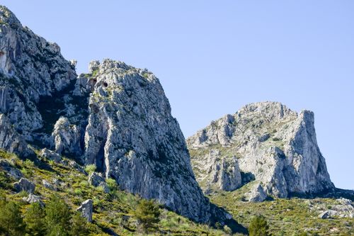 Free Stunning view of rugged rocky mountains under a clear blue sky. Stock Photo