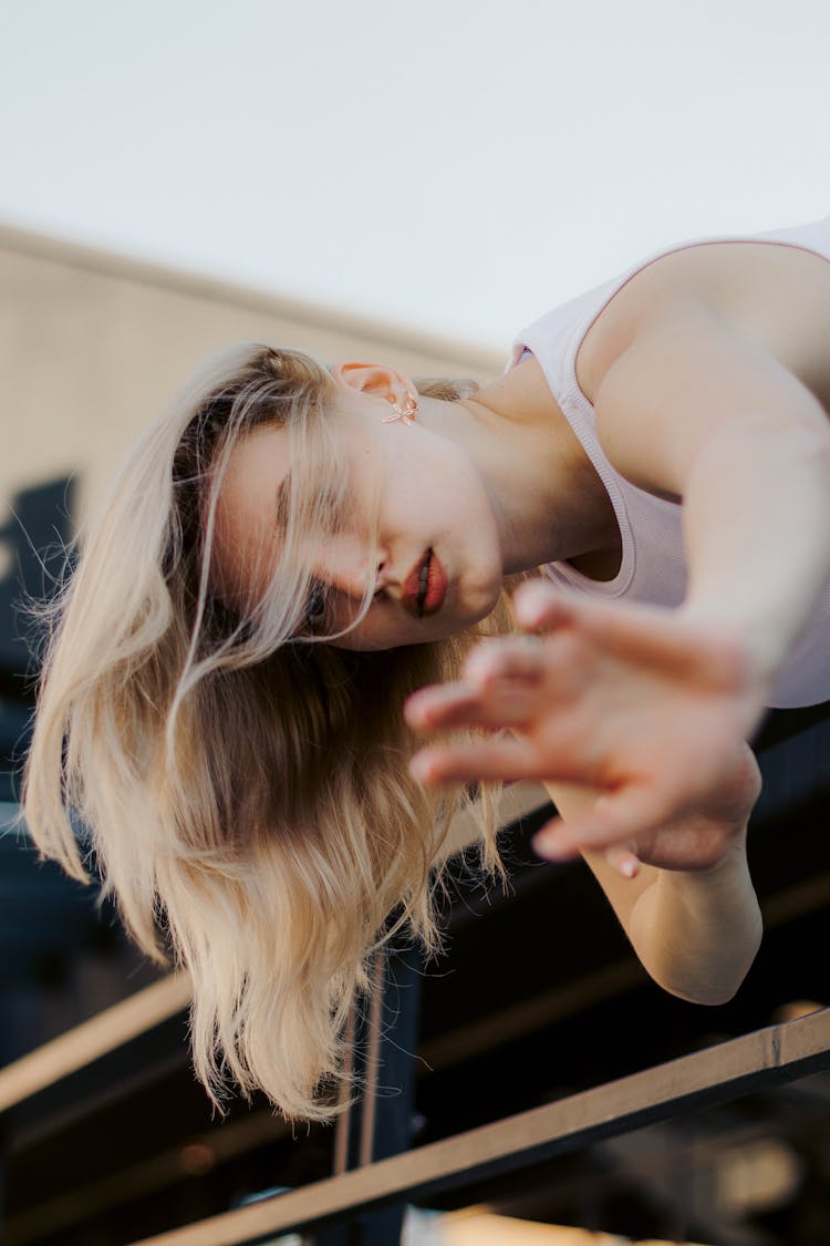 Blond Woman Stretching Arms 