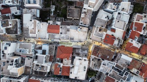 Free Top view of Tinos, Greece showcasing the urban architecture and street layout from above. Stock Photo