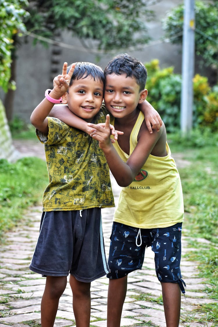 Smiling Kid Boys Standing Arm In Arm