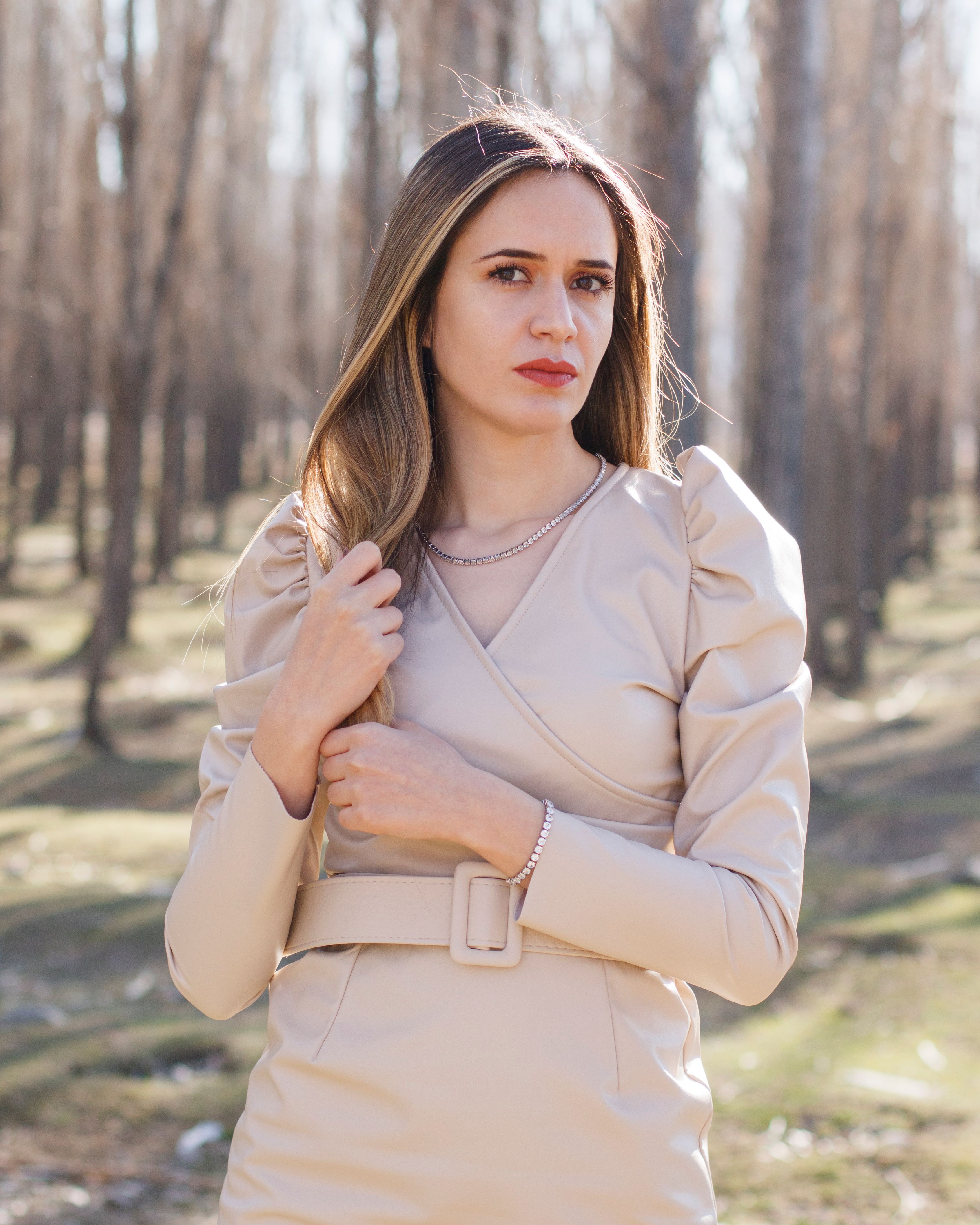 Portrait of a Woman Wearing Beige Long Sleeve Dress · Free Stock Photo