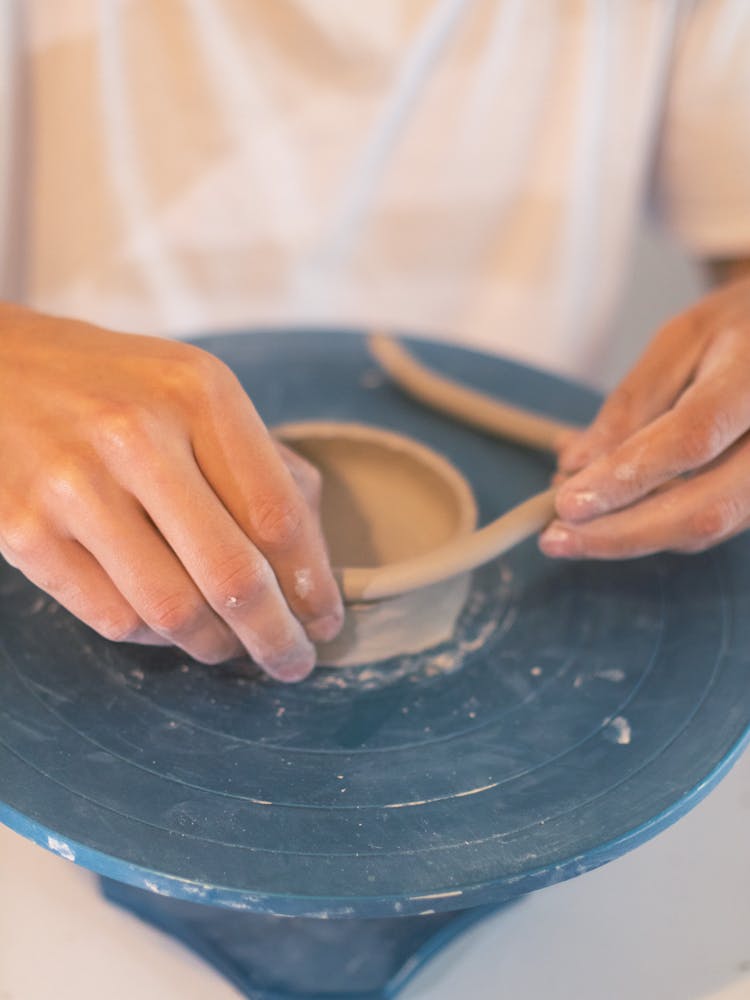 Close-up Of A Person Making A Clay Pot