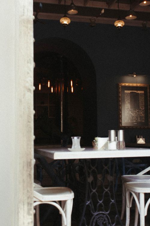 Free A charming café interior with elegant lighting and vintage decor, creating a warm atmosphere. Stock Photo