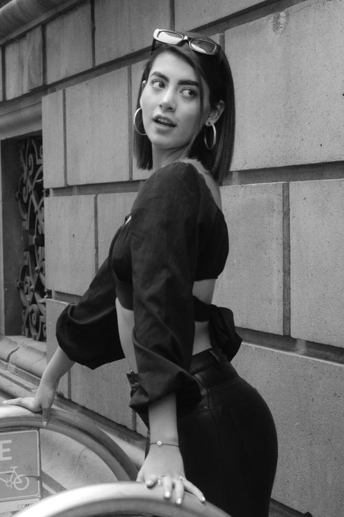 Free Elegant woman in a monochrome outfit posing stylishly outdoors. Stock Photo