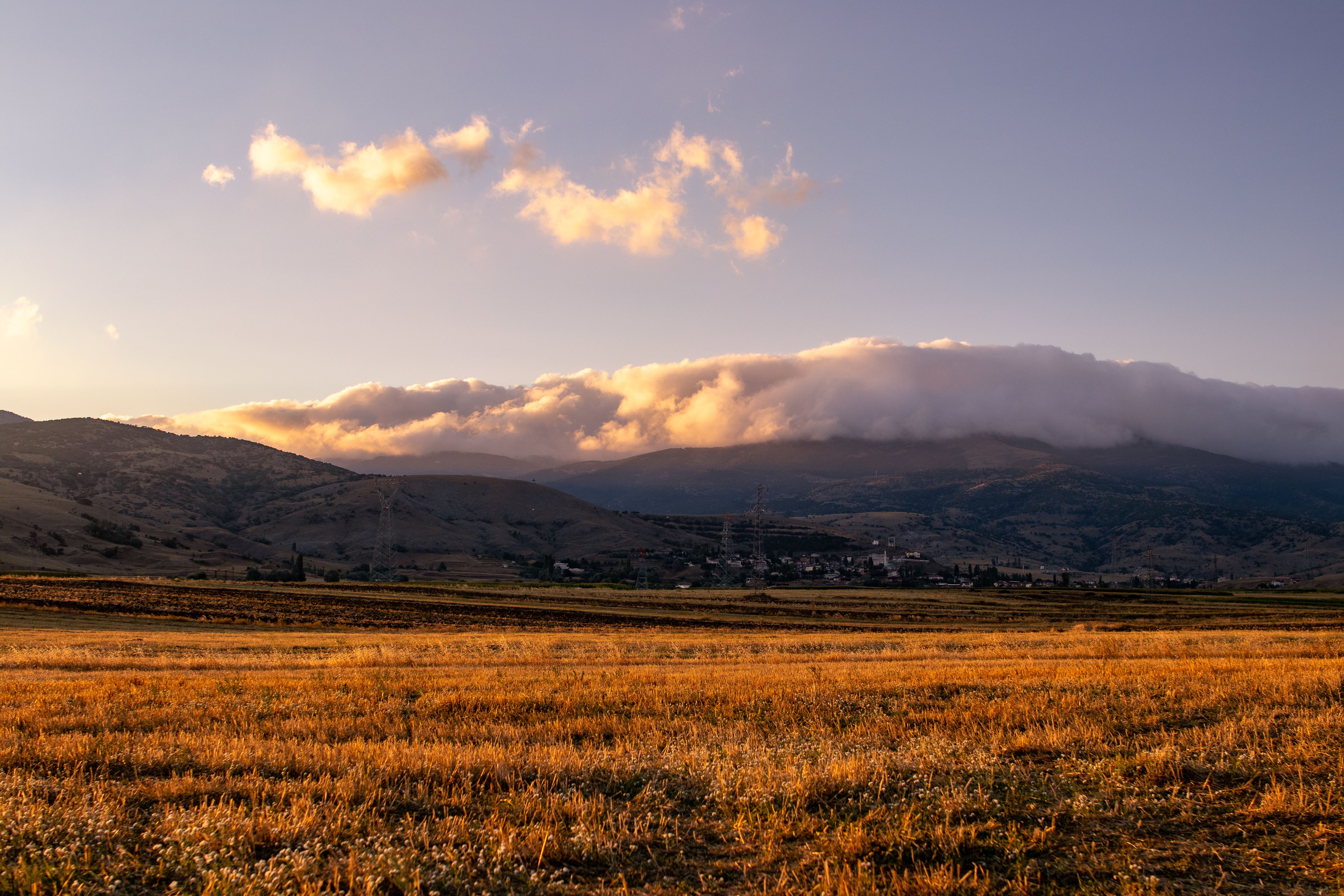Grass Field Near the Mountain Under Blue Sky · Free Stock Photo
