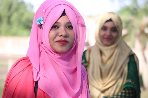 Free Portrait of young women wearing colorful hijabs outdoors, showcasing traditional culture. Stock Photo