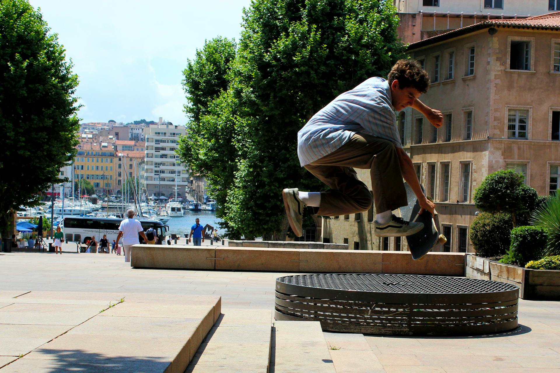 Teenage Boy Doing Skateboard Tricks on Park Steps