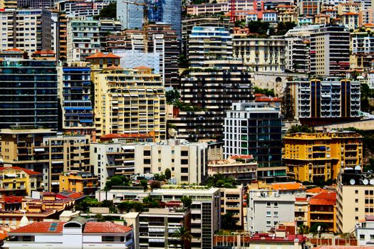 Explore the vibrant cityscape with densely packed buildings and skyscrapers showcasing urban architecture.