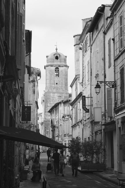 Captivating black and white photo of an old European street with classic architecture.