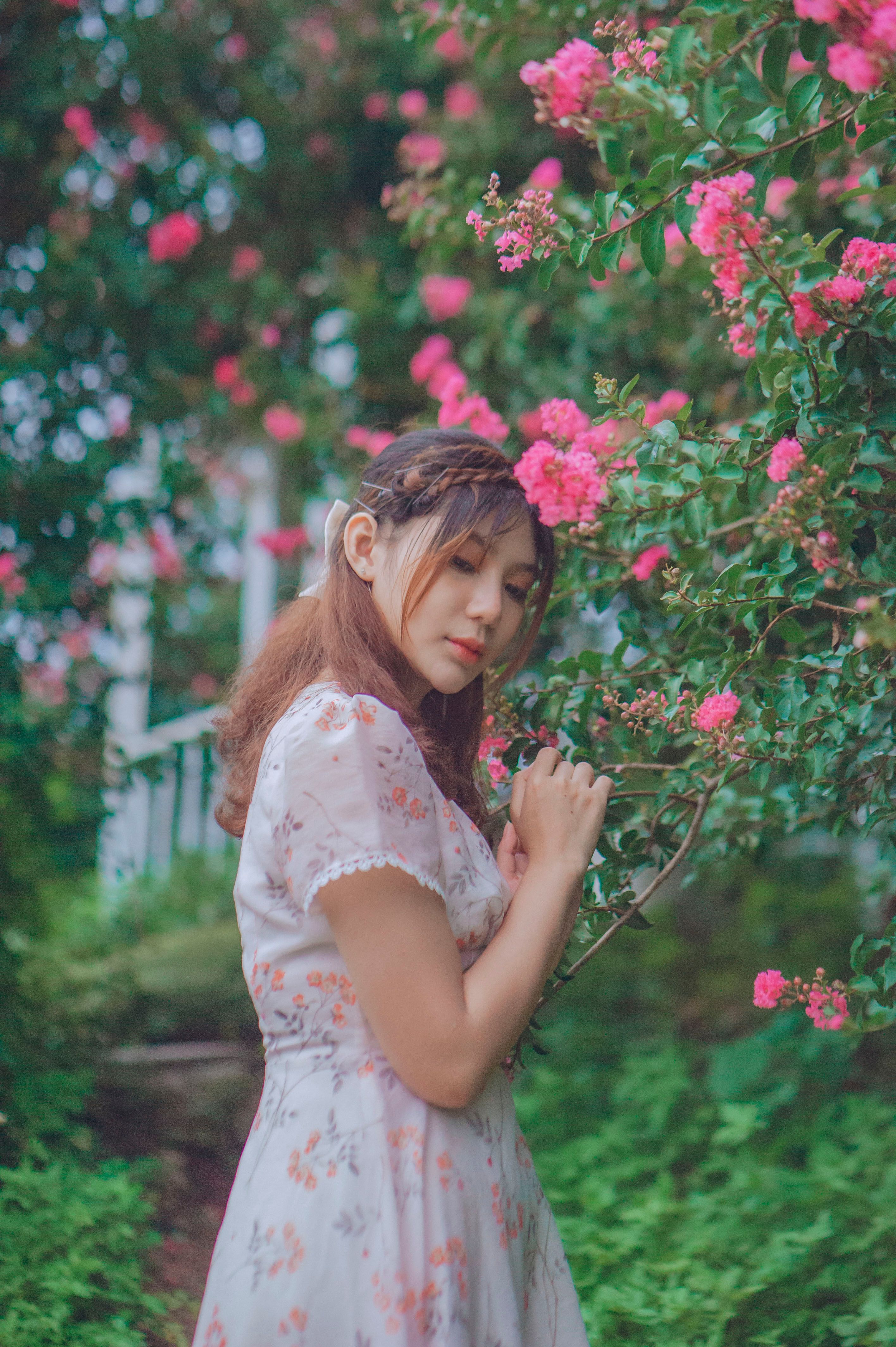 Young Woman in a Dress Walking in the Garden · Free Stock Photo