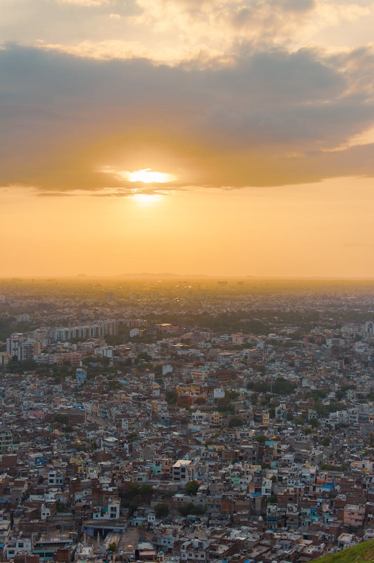 Sun Behind Cloud Over City