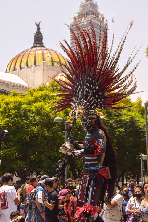 Free Performer with feathered headdress at festival in Ciudad de México. Stock Photo