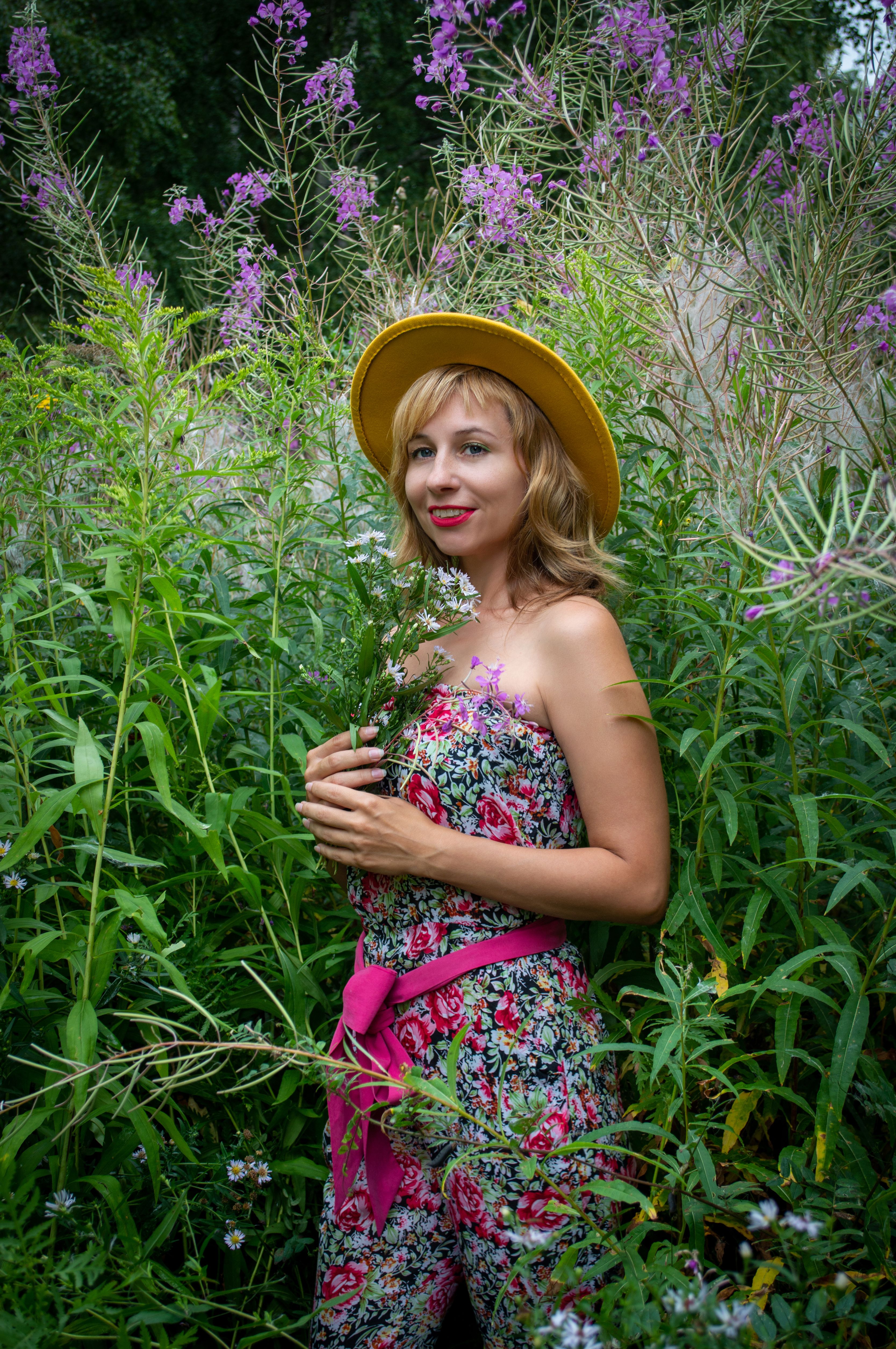 Woman in Pink Floral Dress Surrounded with Plants · Free Stock Photo