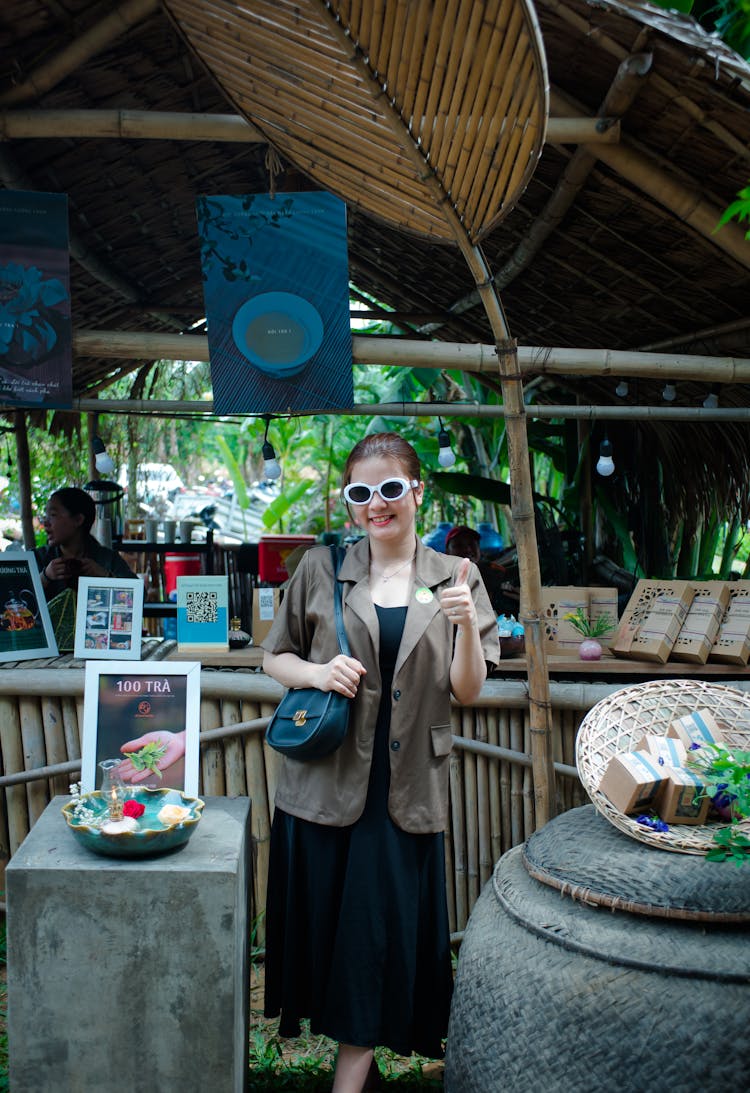 Woman In Exotic Restaurant Showing Thumb Up