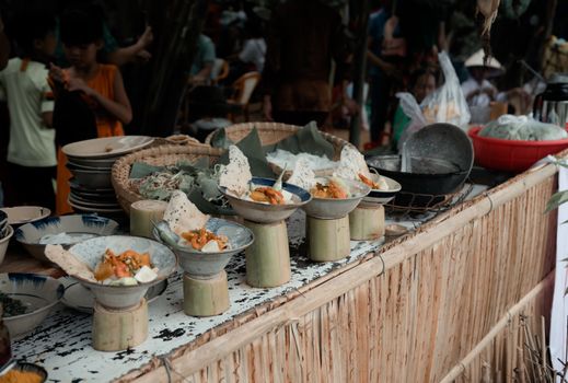 Explore the vibrant flavors of street food in a bustling market showcasing Asian cuisine.