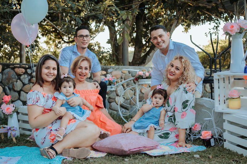 An extended family gathered outdoors for a celebration — Catalina Herrera on Pexels