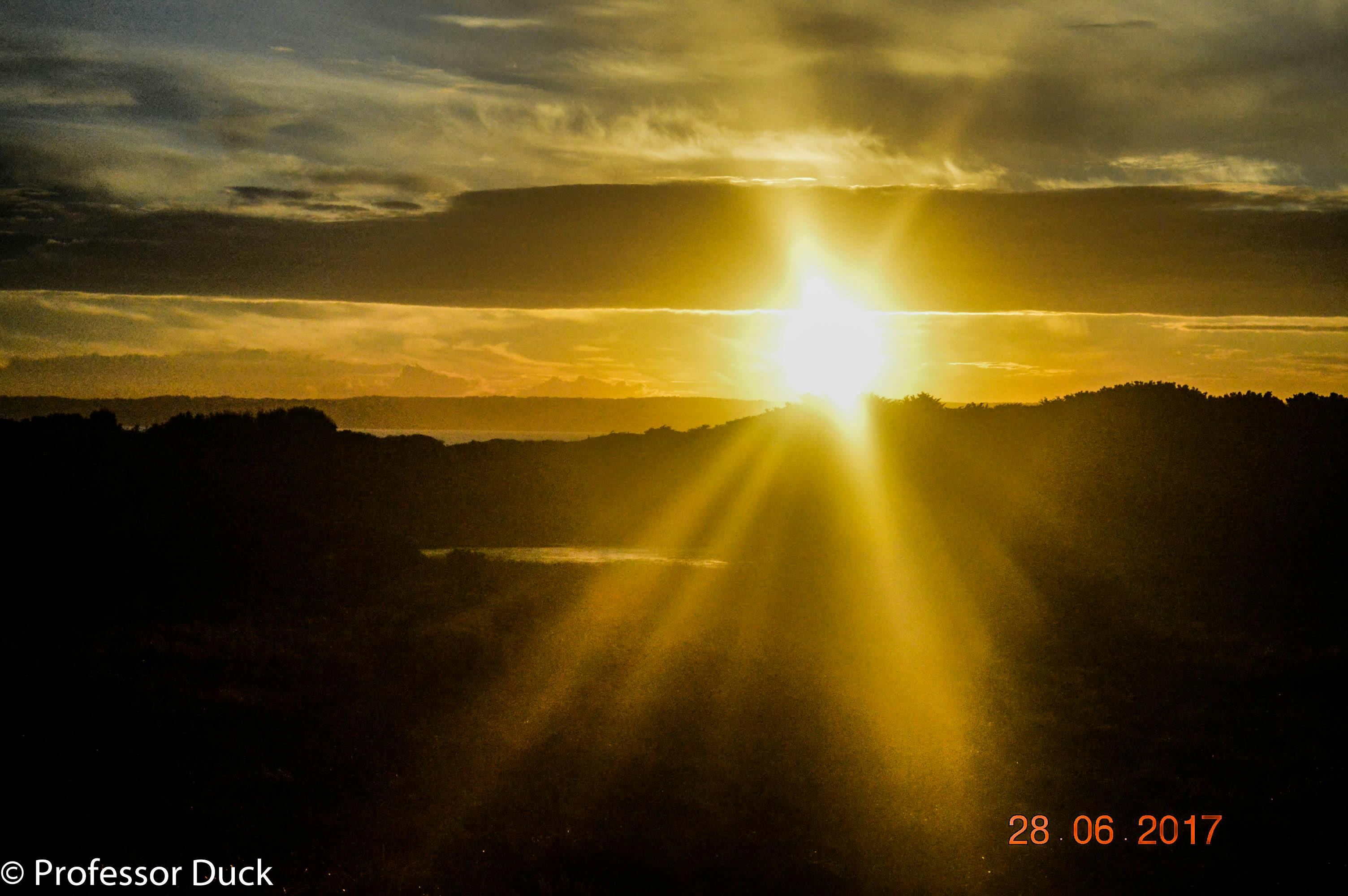 Person meditating with colorful light symbolizing chakra energy centers