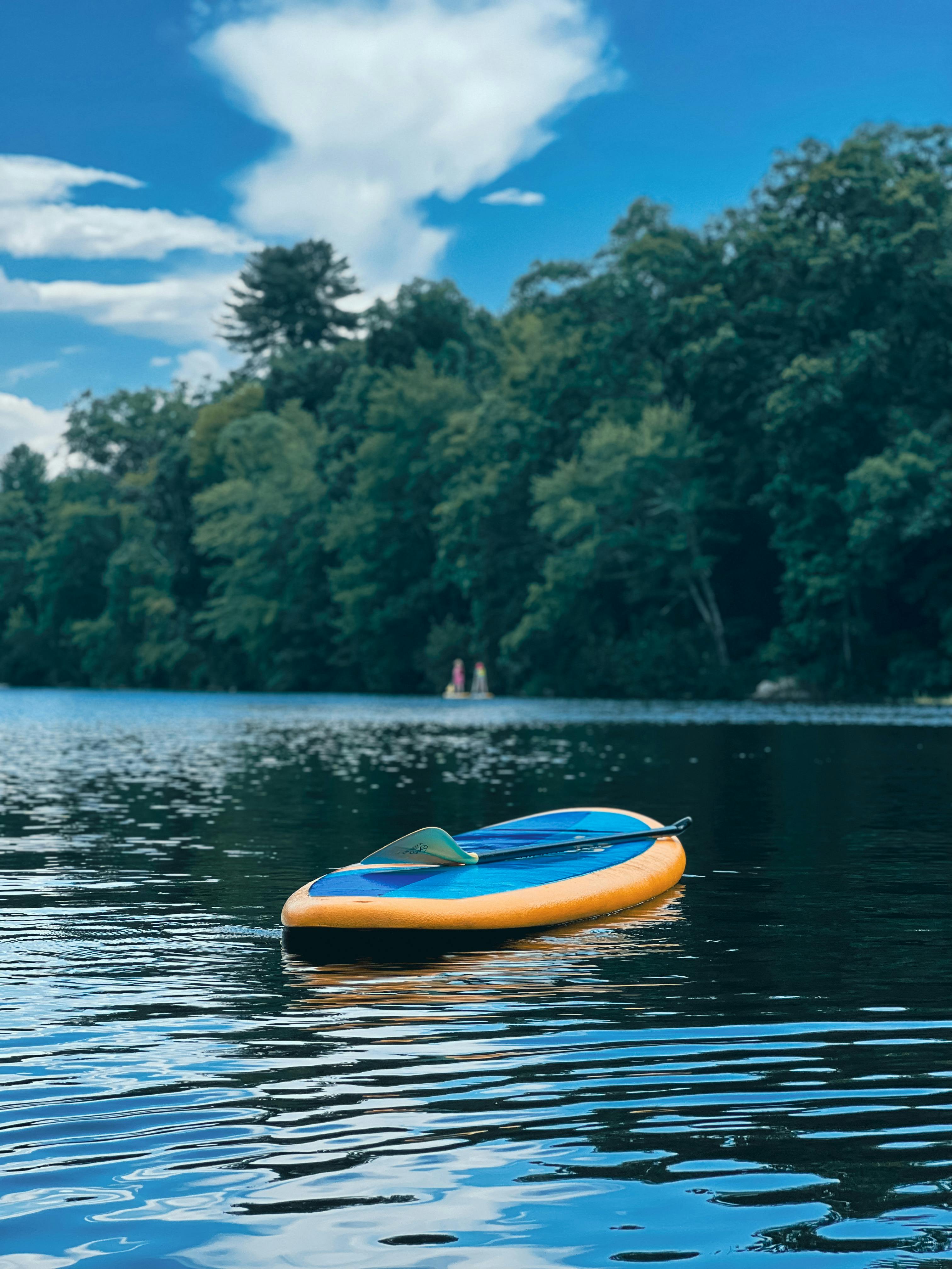 Yellow and Blue Kayak on the Lake
