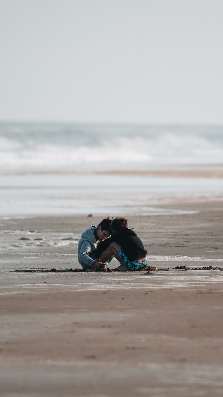 Teenager Boys Playing In The Beach