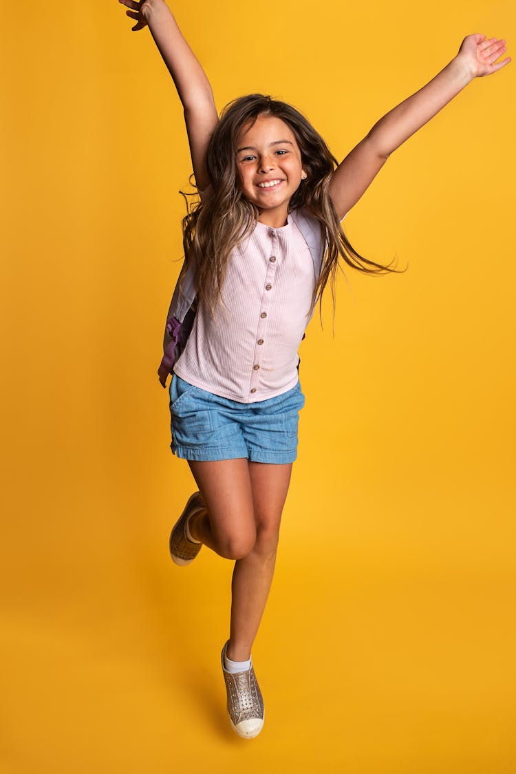 Girl Carrying A Backpack