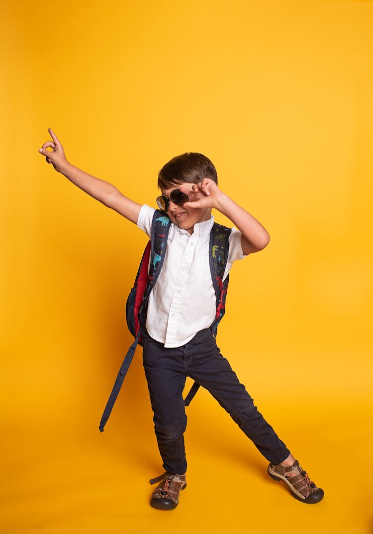 Boy Holding His Sunglasses