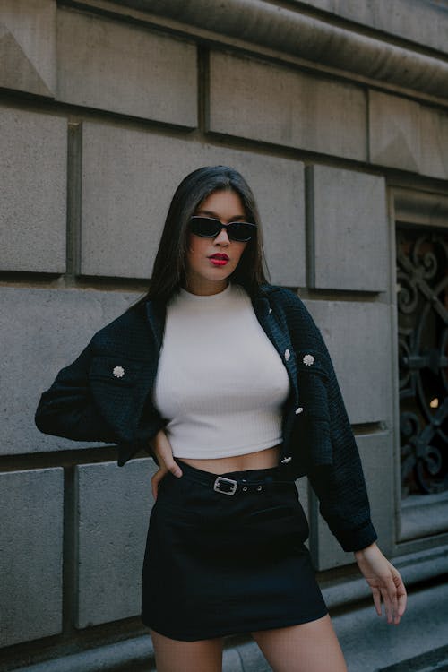 Brunette Fashionable Woman in Sunglasses Posing in City 