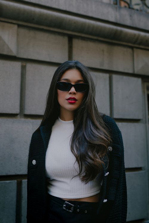 Free Fashionable woman with long brunette hair wearing sunglasses in Mexico City. Stock Photo
