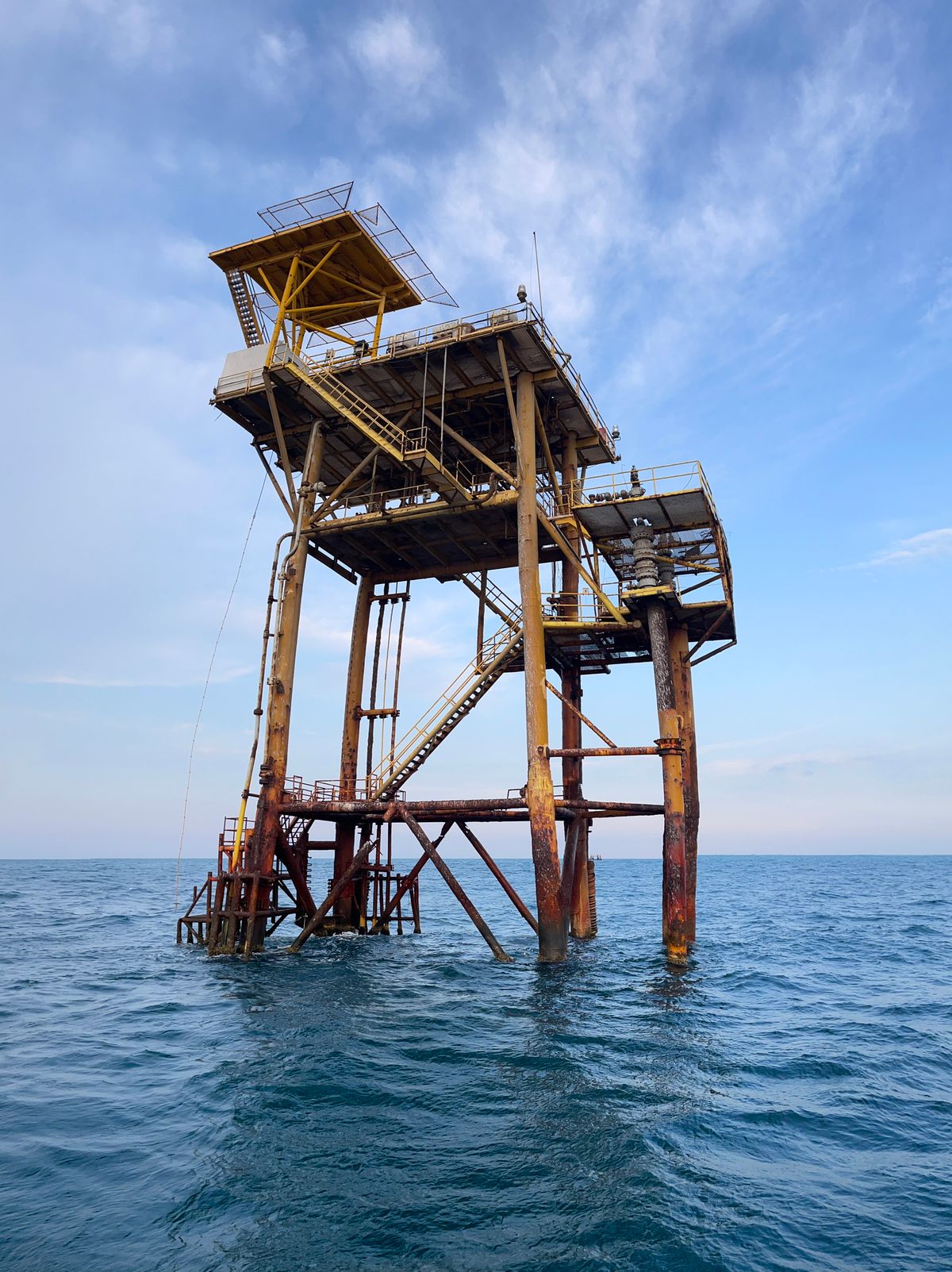 Offshore oil platform under a blue sky