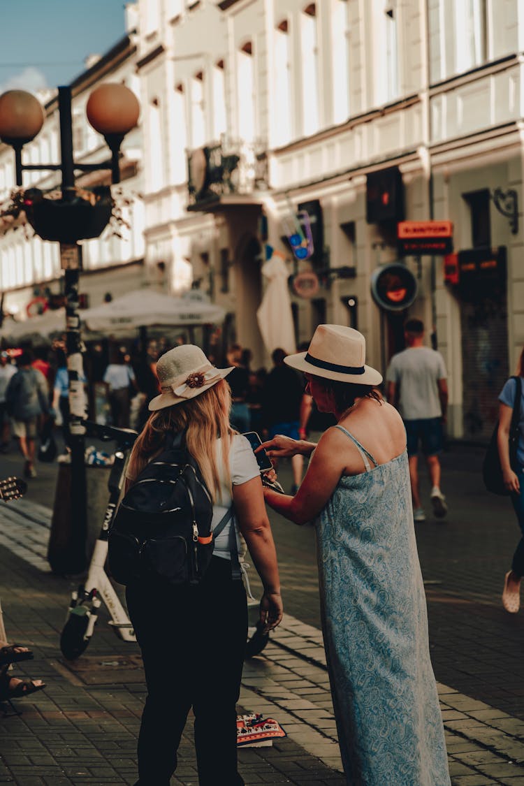 Women Using Smartphone In City