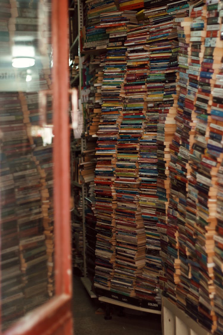 Pile Of Used Books Inside A Bookstore