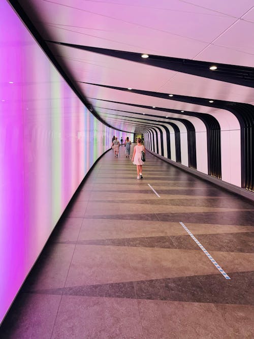 People Walking in Underground Tunnel