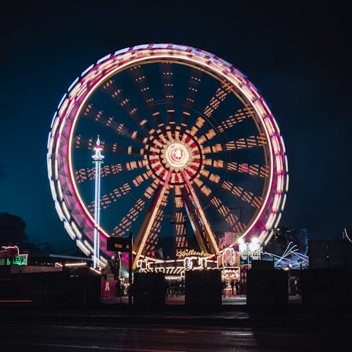 Ferris Wheel With Lights Turned on during Night Time