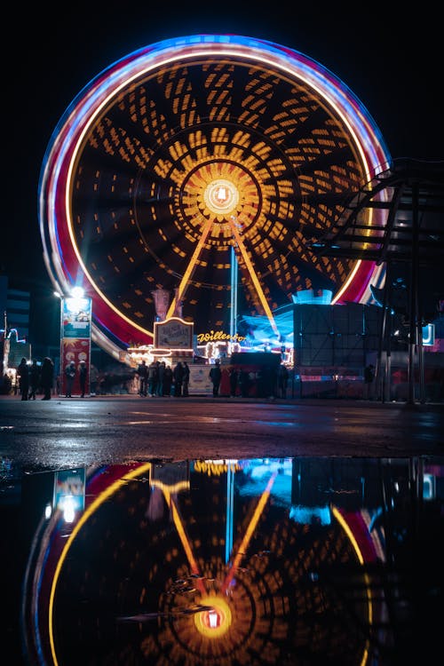 Ferris Wheel With Lights Turned on during Night Time