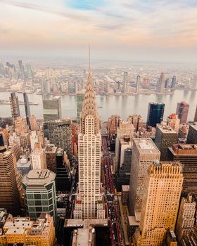 Stunning aerial view of the Chrysler Building in NYC's skyline with urban architecture and skyscrapers.