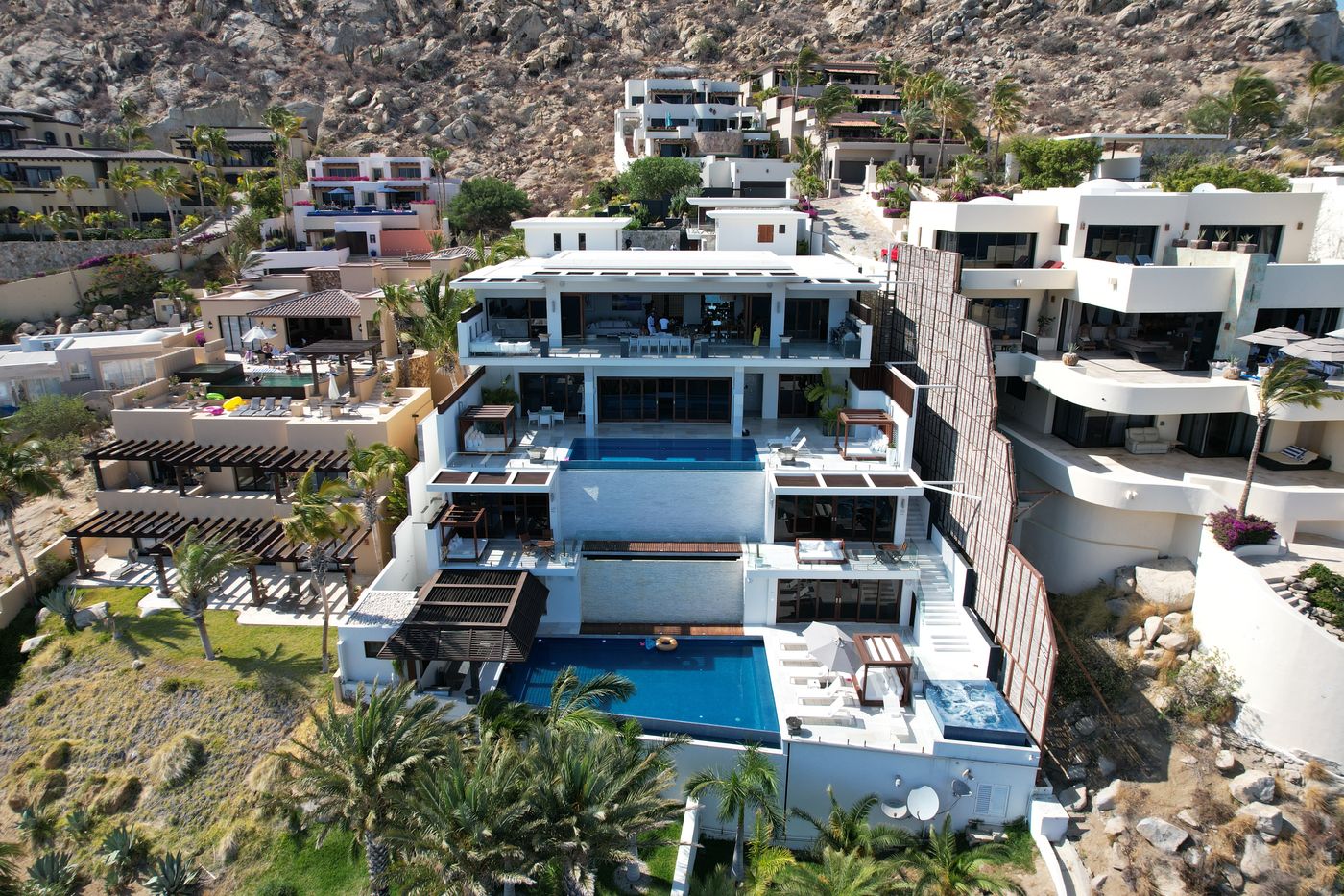 Aerial view of modern hillside villas facing the ocean in Cabo San Lucas