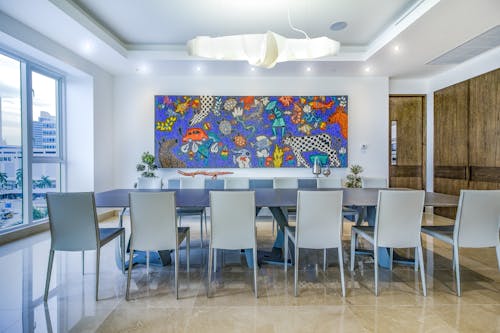 Table in Living Room with Decoration on Wall behind