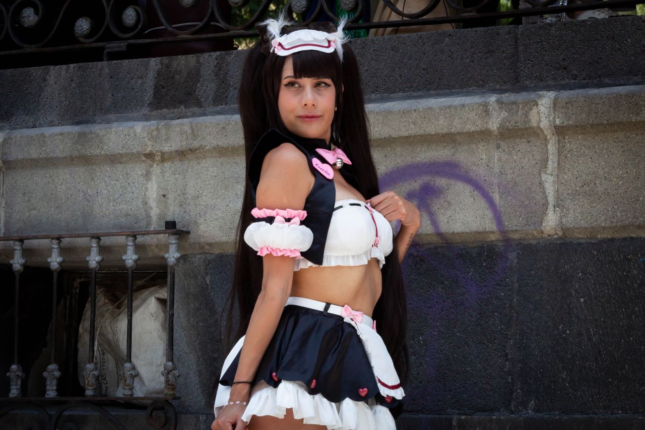 a woman showcasing a stylish cosplay outfit with gothic elements outdo