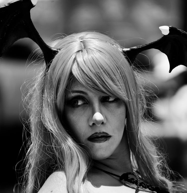 Grayscale Photo Of A Woman Wearing A Costume 