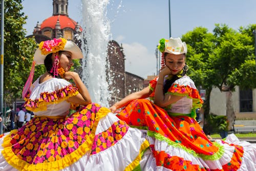 Two Women Wearing a Floral Traditional Clothing