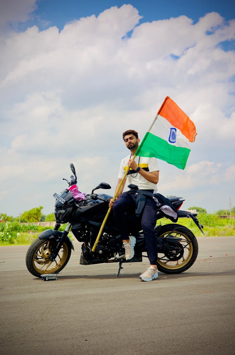 A Man Holding The Flag Of India