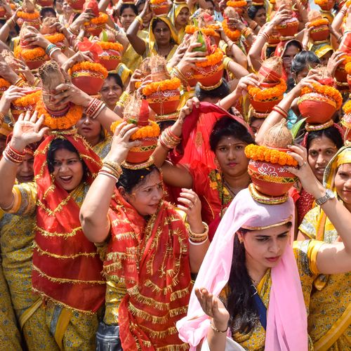 Free Vibrant festival showing Indian women in traditional attire during a cultural celebration. Stock Photo
