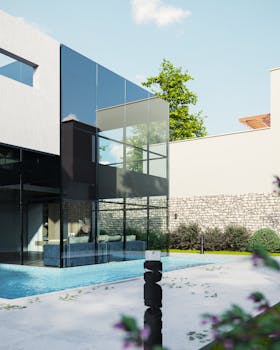 A contemporary house with a striking glass facade and pool exterior.