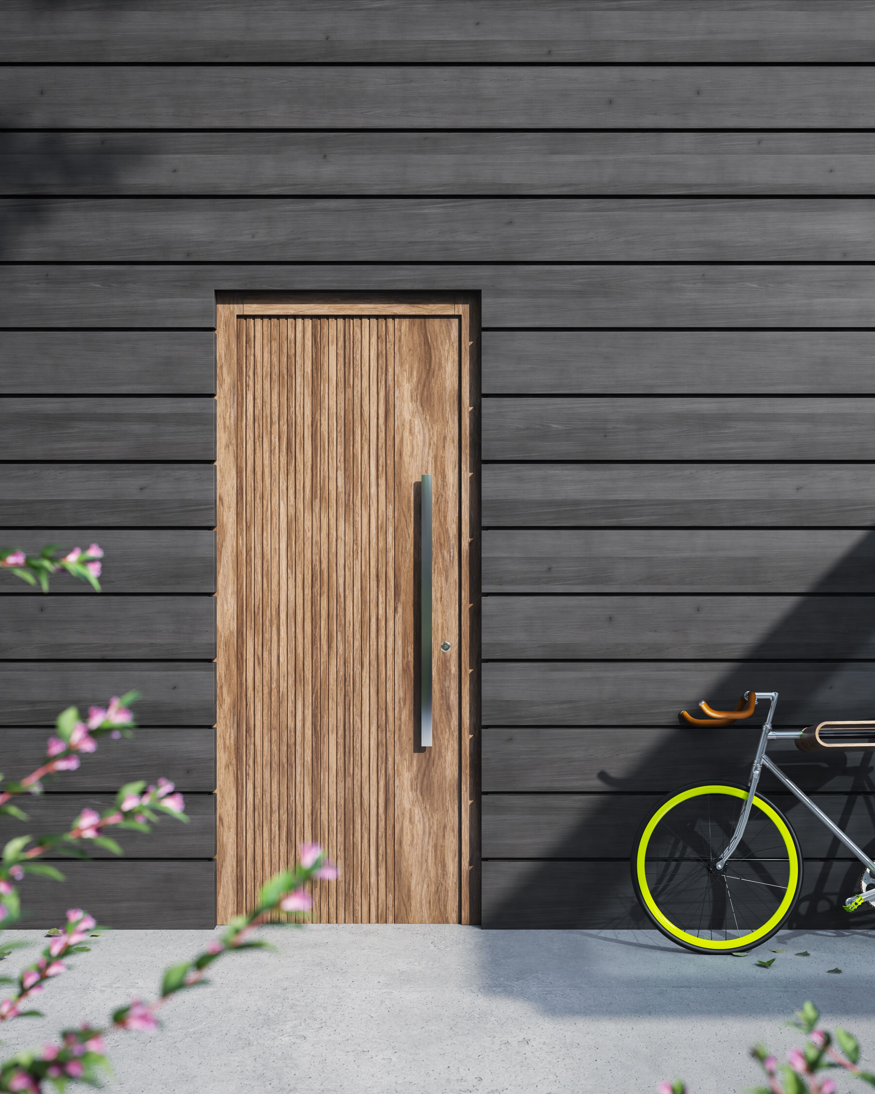 A wooden door and bicycle against a modern gray facade, perfect for contemporary architectural themes.