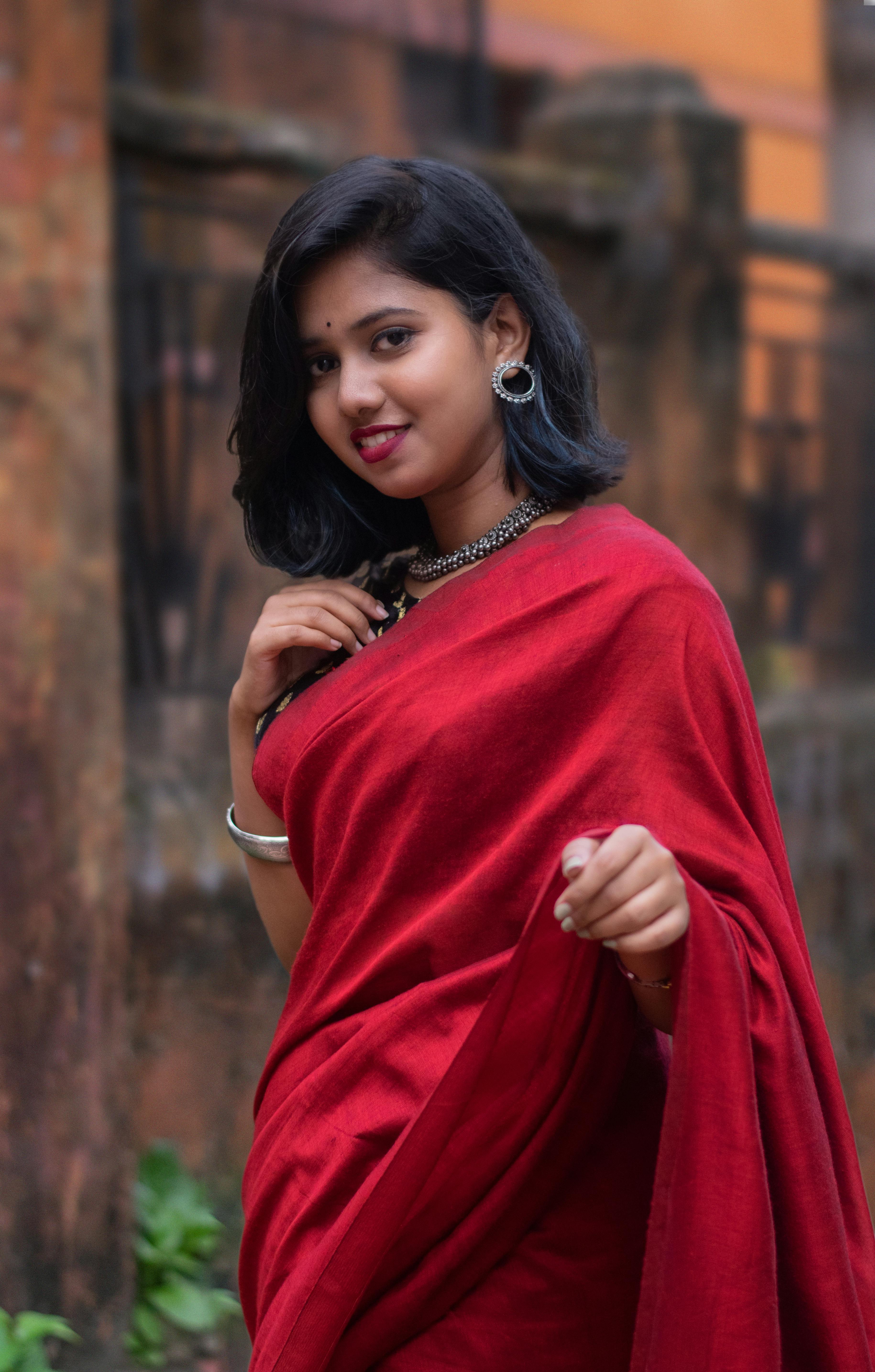 Beautiful young girl posing in Indian traditional saree on white  background. Stock Photo | Adobe Stock