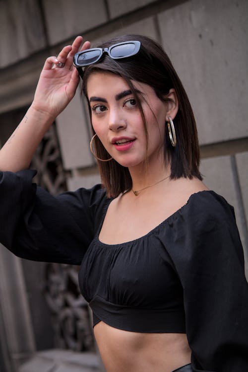 A Woman in Black Scoop Neck Long Sleeve Crop Top