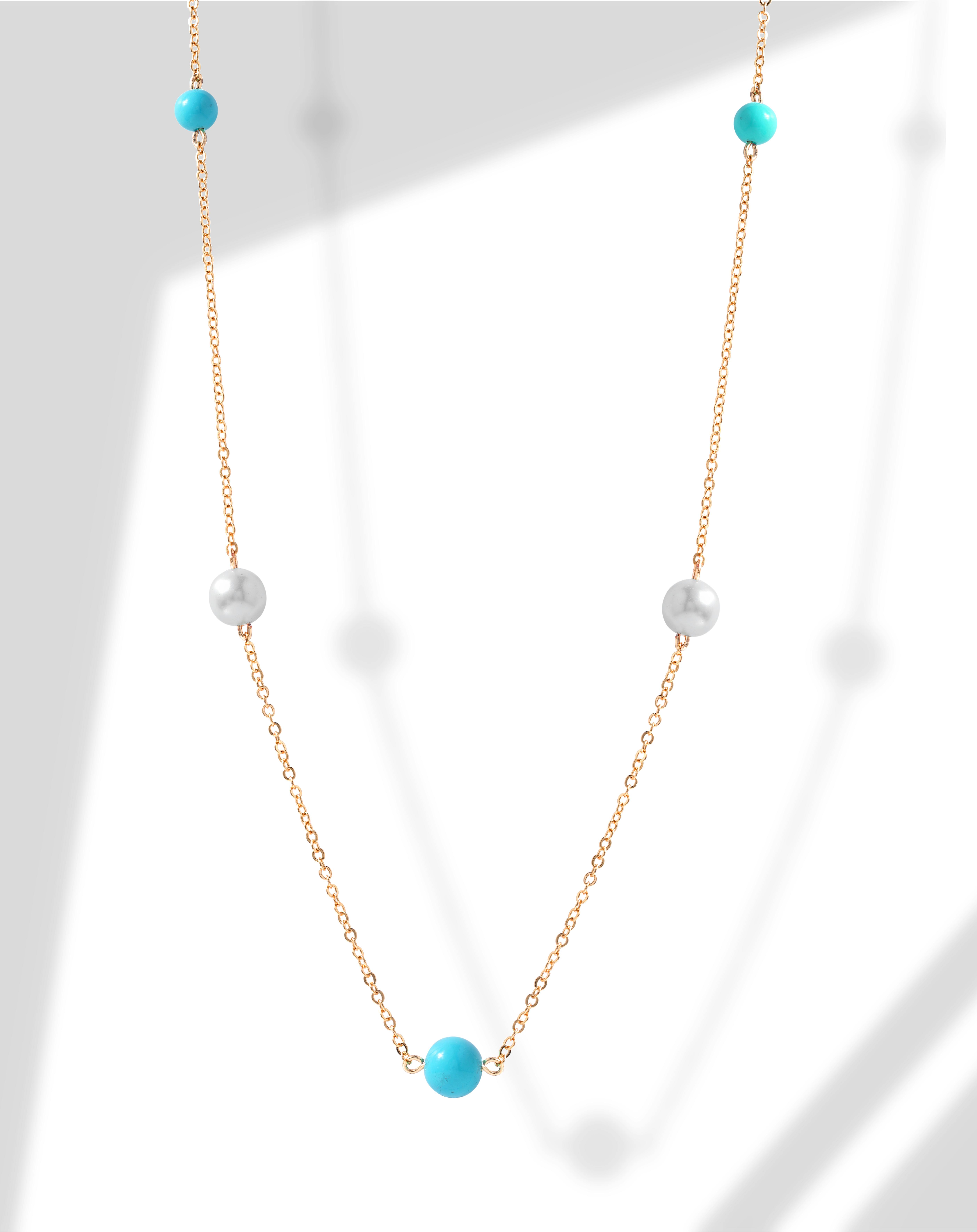 photo of gold chain with blue round pendant