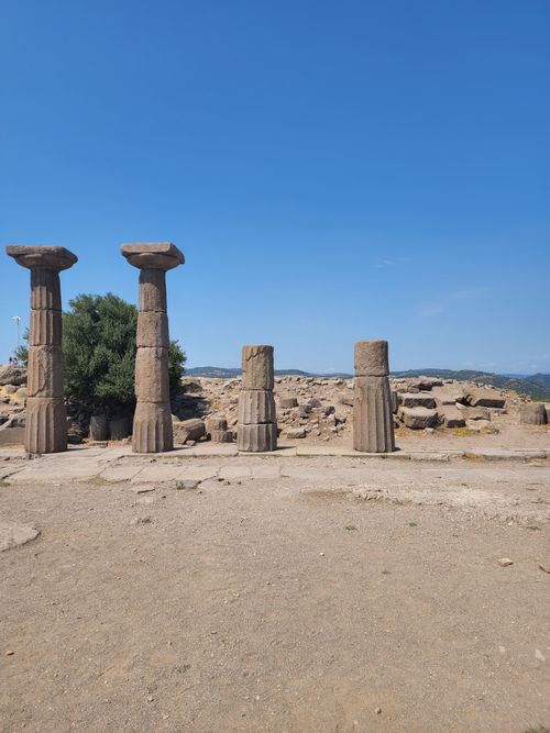 Free Explore the ancient columns of the Temple of Athena in Assos, Türkiye, under a clear blue sky. Stock Photo