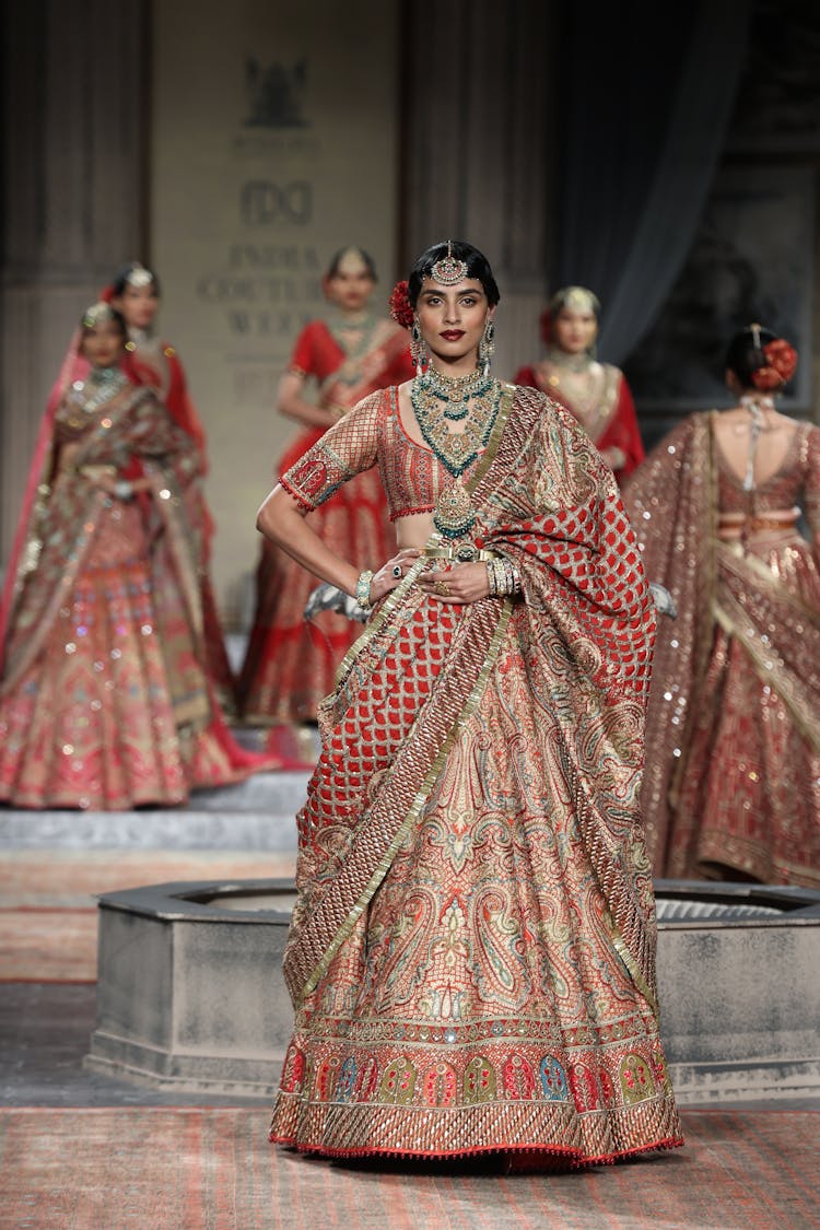 Models Tamping Wedding Clothes In A Fashion Show