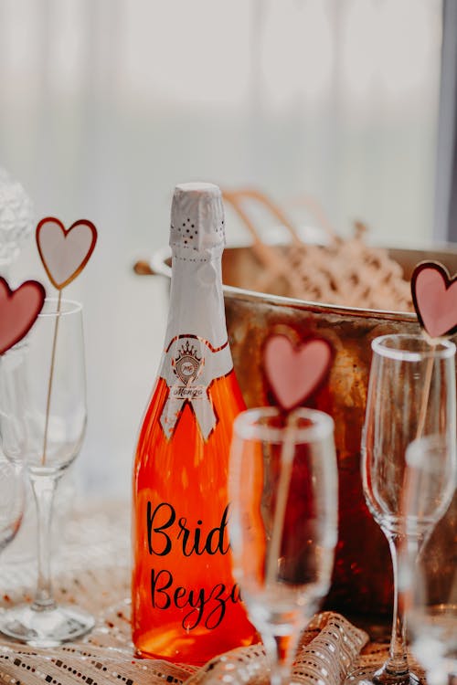 A Close-Up Shot of a Champagne Bottle and Champagne Glasses