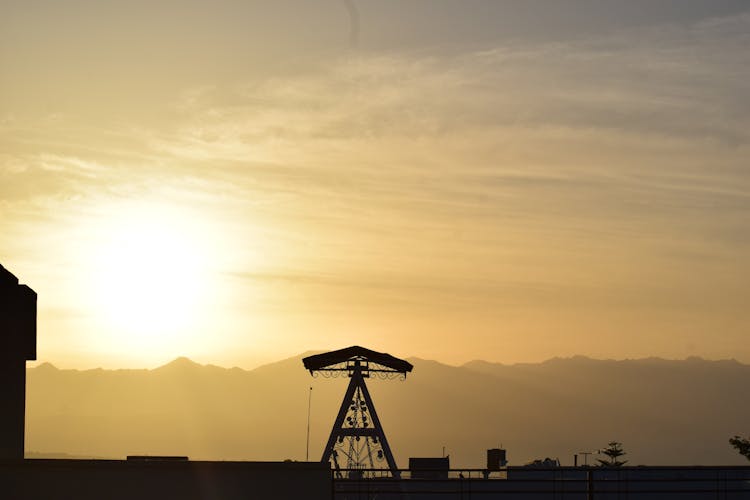 Silhouette Of A Structure At Sunset